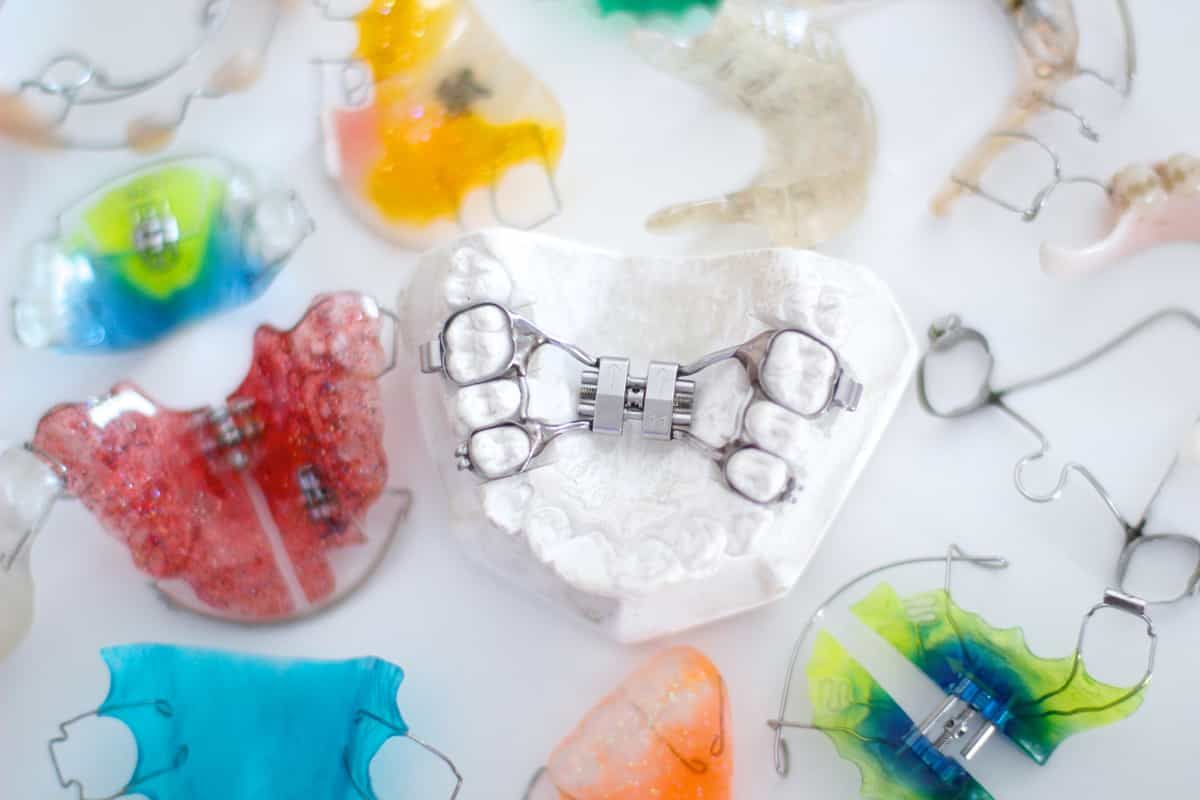 Clear orthodontic retainer and aligner tray fabricated in the lab